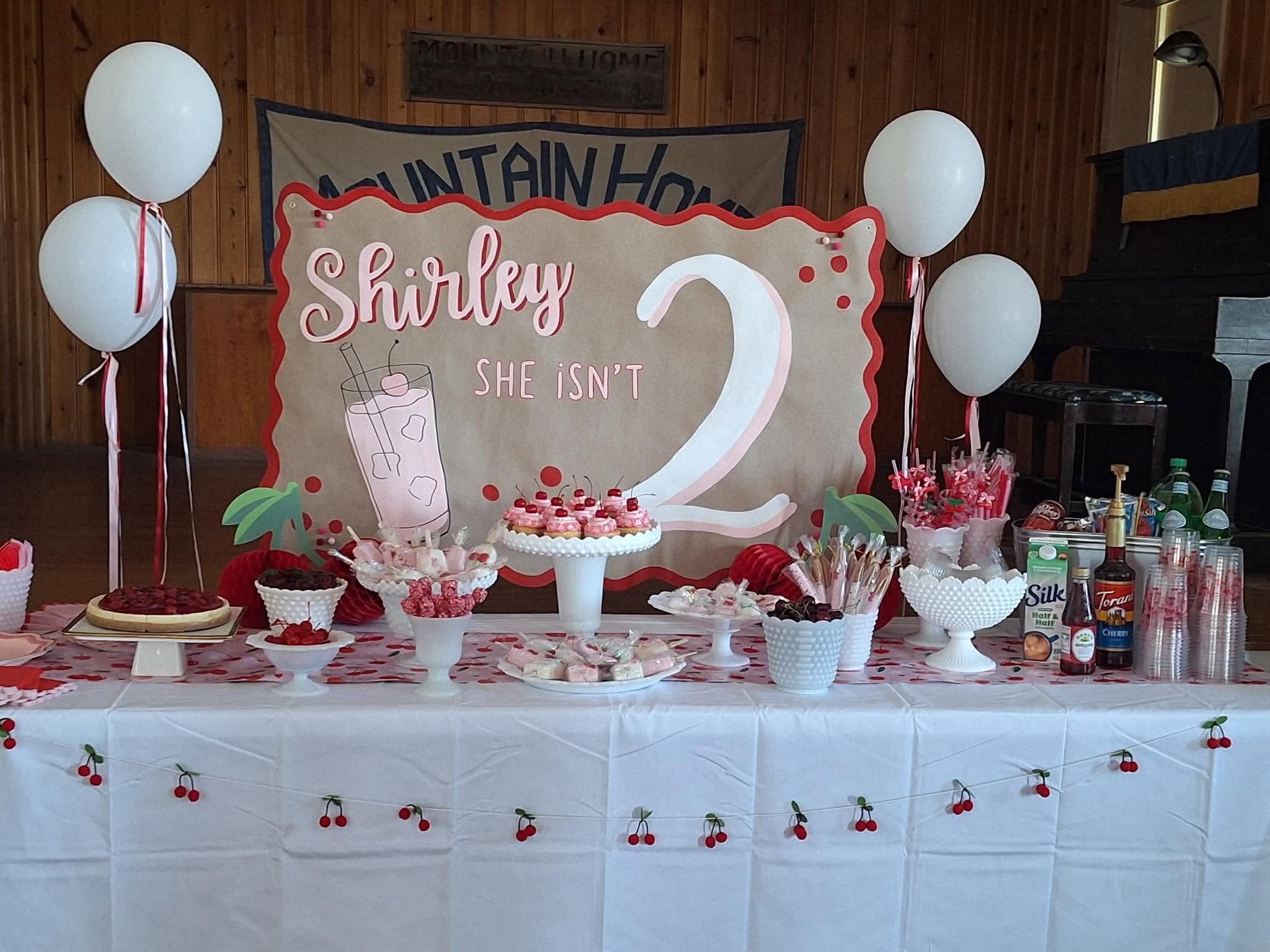 Cherry-themed dessert table spread